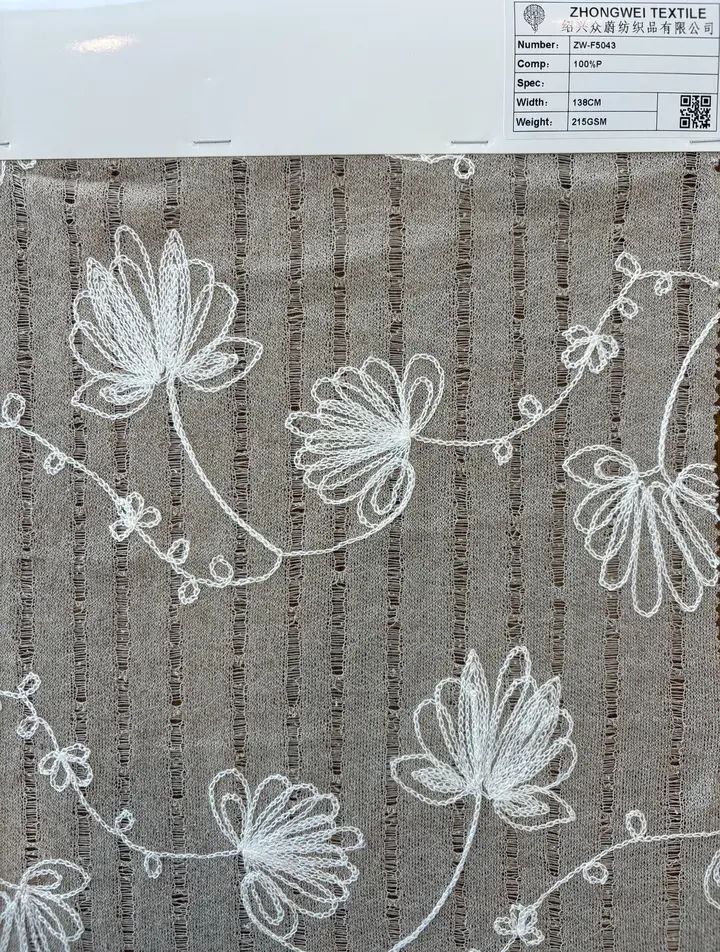 Photo du tissu Tissu rayé ajouré à broderies florales, référence ZW-F5043