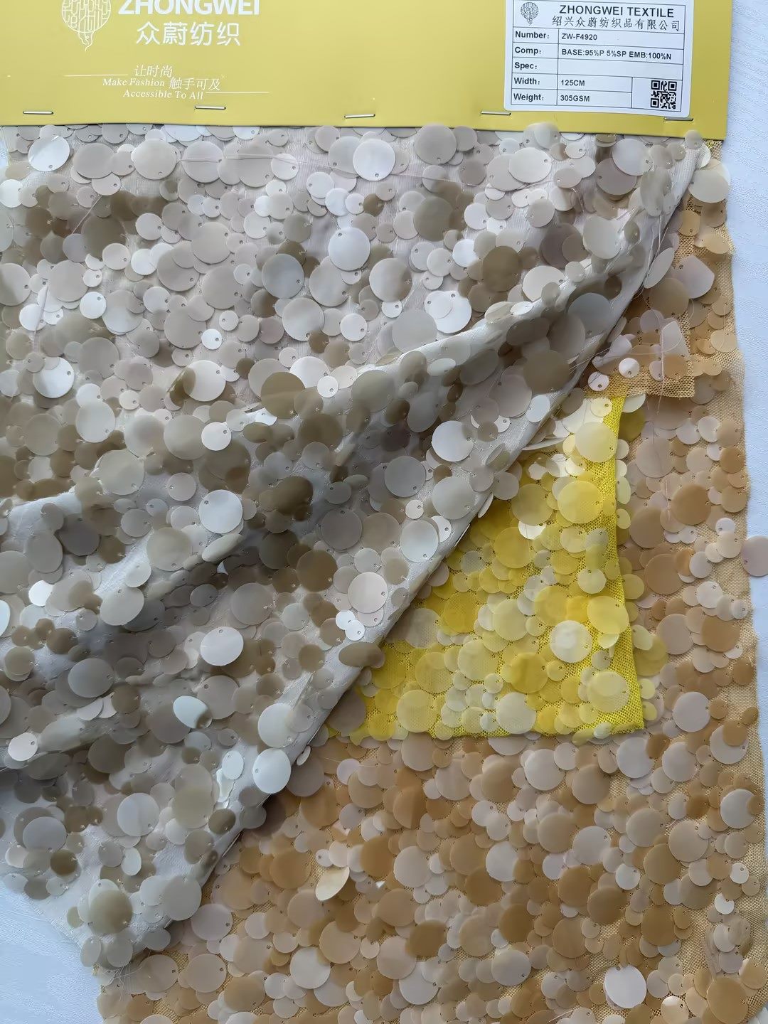 Ivory sequin embroidered mesh fabric sample
